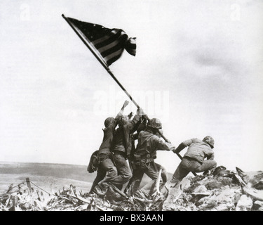 RAISING THE FLAG ON IWO JIMA  23 February 1945. Photo Joe Rosenthal/AP agency. See Description below Stock Photo