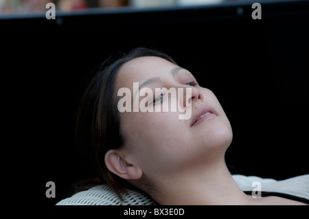 Young woman reclining Stock Photo