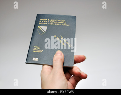 Female hand holding Bosnian passport Stock Photo