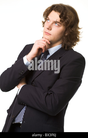 Portrait of pensive businessman touching his chin while thinking Stock Photo