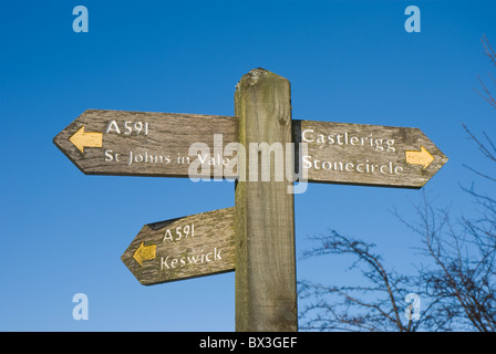 3-way wooden public footpath sign in the Lake District, Cumbria Stock Photo