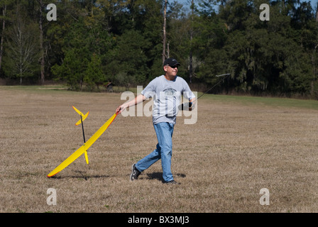 man prepares to launch his radio controlled hand launch glider during competition, Alachua, Florida Stock Photo