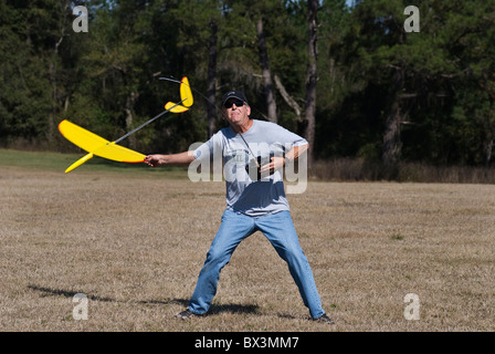 man launches his radio controlled glider during hand launch glider competition, Alachua, Florida. Stock Photo