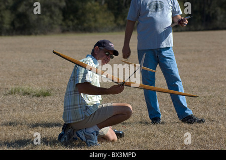 man working with his radio controlled hand launch glider during competition, Alachua, Florida. Stock Photo