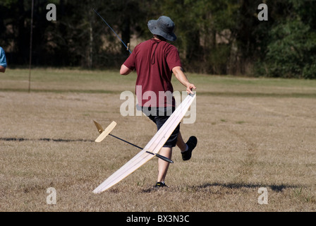 man prepares to launch his hand launch glider during competition, Alachua, Florida. Stock Photo