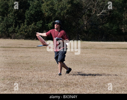 man launches his radio controlled hand launch glider during competition, Alachua, Florida. Stock Photo