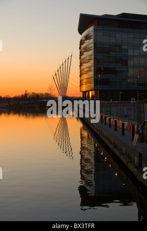MediaCityUK buildings and new footbridge over the Manchester Ship Canal at sunset.  Salford Quays, Manchester, England, UK. Stock Photo