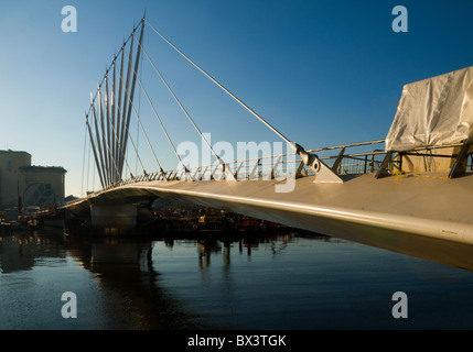 The new (2010) swing footbridge over the Manchester Ship Canal at MediaCityUK, Salford Quays, Manchester, England, UK. Stock Photo