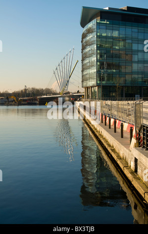 MediaCityUK buildings and new footbridge over the Manchester Ship Canal at Salford Quays, Manchester, England, UK. Stock Photo