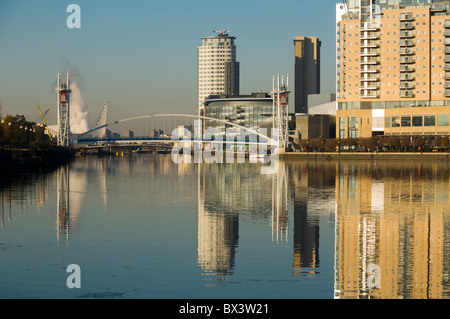 The Millennium footbridge and MediaCityUK buildings over the Manchester Ship Canal at Salford Quays, Manchester, England, UK Stock Photo