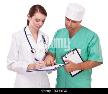 Doctors completing on medical card. Isolated on a white. Stock Photo