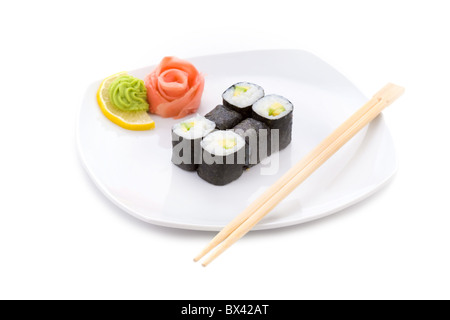 Image of sushi rolls with wooden chopsticks on a plate Stock Photo