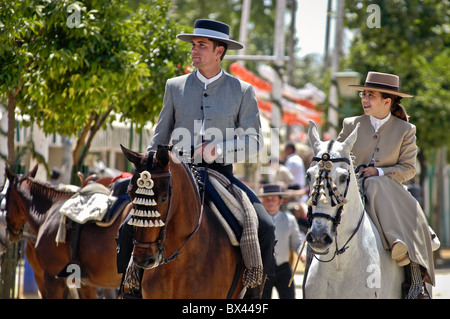 Locals on horseback dressed in Andalusian costume for the fiesta of El Rocio, Seville, Spain Stock Photo