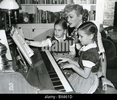 EVE ARDEN (1908-1990) US film and TV actress with her children Lisa at right and Connie Stock Photo