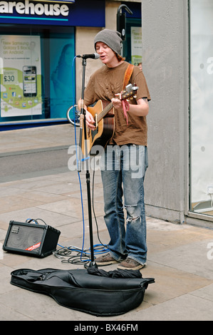 Busker Busking on a City Street, Oxford, UK. Stock Photo