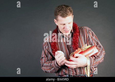 A man opens a gift Stock Photo