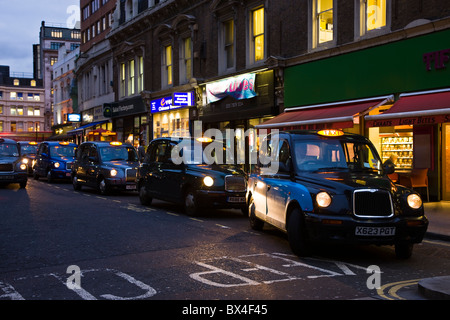 Row of black cabs taxis near Liverpoool Street Station, London, UK Stock Photo