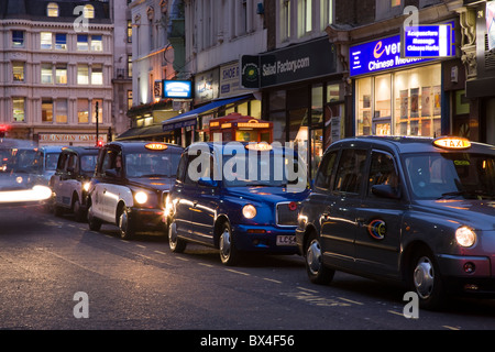 Row of black cabs taxis near Liverpoool Street Station, London, UK Stock Photo