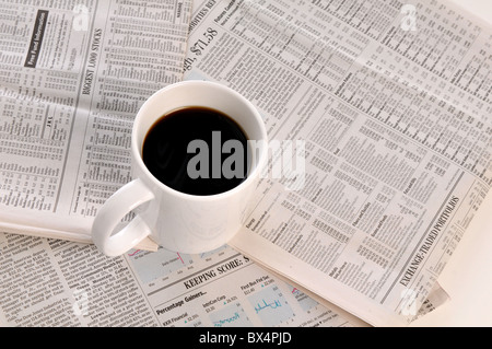 Business newspapers and cup of coffee isolated on a white background Stock Photo