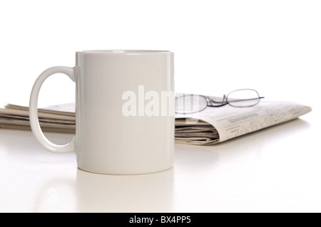 Cup of coffee, newspaper and glasses isolated on a white background Stock Photo