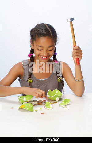 A girl counting her savings Stock Photo