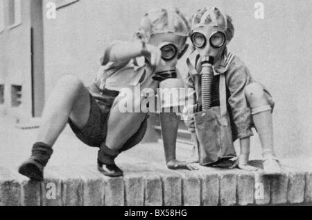 Czechoslovakia 1938, children in gas masks learning to protect themselves against attack. Stock Photo