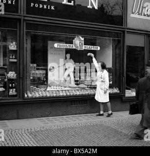 Czechoslovakia Prague - 1949. 'Pramen' food store is run by young members of Czechoslovak  Youth Union. Photo: Woman cleans Stock Photo