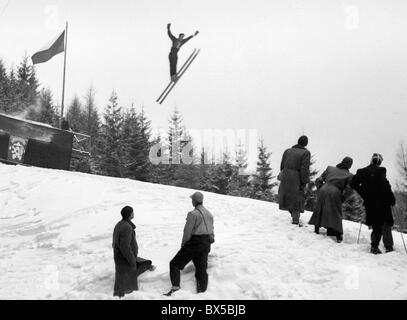 Czechoslovakia, Spindleruv Mlyn 1947. Ski jumper balancing in the air in funny pose during his jump. CTK Vintage Photo Stock Photo