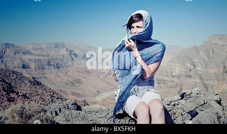 Shot of a Woman in Head Scarf in Omani Mountains Stock Photo