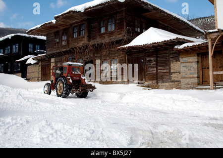 Tractor in Architectural Reserve Zheravna in winter snow Stock Photo