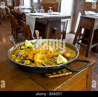 Seafood paella in serving skillet in restaurant on Las Ramblas, Barcelona, Spain Stock Photo