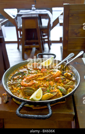 Seafood Paella in serving skillet in restaurant on Las Ramblas, Barcelona, Spain Stock Photo