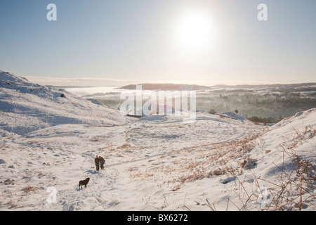 Walking on Loughrigg in the Lake District, UK, in winter weather. Stock Photo