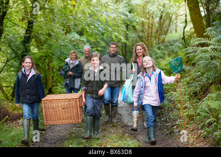 Family walking through the woods Stock Photo