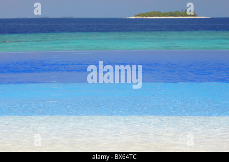 Swimming pool and tropical island, Maldives, Indian Ocean, Asia Stock Photo