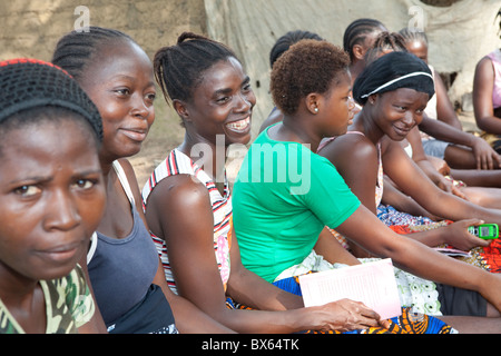 Women attend a community microfinance meeting in Kakata, Liberia, West Africa. Stock Photo