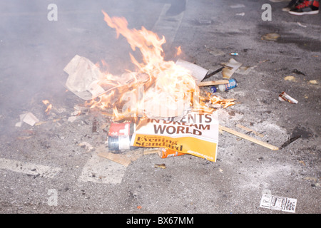 A small fire is made as students protest against rise in tuition fees in Whitehall, central London. Stock Photo