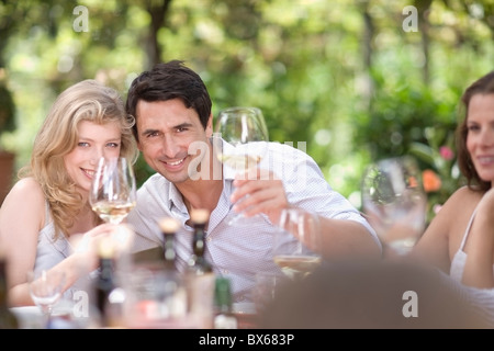 Crowd clinking glasses Stock Photo