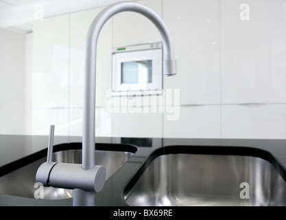 kitchen faucet and oven modern black and white interior design Stock Photo