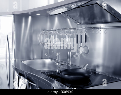 Kitchen silver sink and vitroceramic stove hob modern decoration Stock Photo