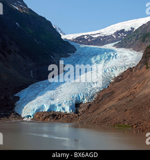 Bear Glacier in British Columbia close up landscape, scenery, with blue snow, ice, mountain in background,and lake in foreground Stock Photo