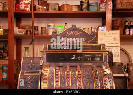 Old, antique cash register in a vintage apothecary shop in Yukon Territory, Canada. Stock Photo