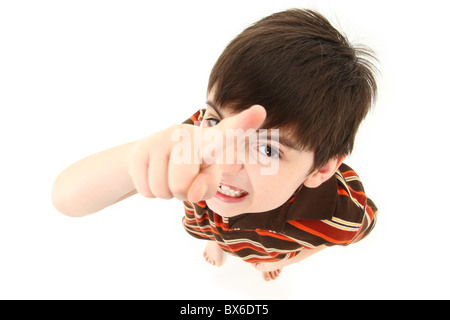 Adorable seven year old french american boy pointing angry to camera over white background. Stock Photo