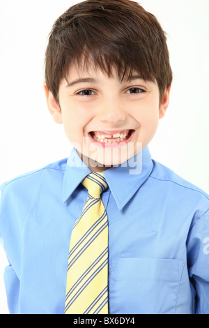 Adorable 7 year old french american boy close up in shirt and tie over white background. Stock Photo