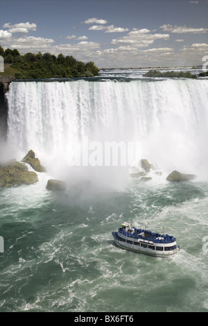 Maid of the Mist sails near the American Falls in Niagara Falls, New York State, United States of America, North America Stock Photo