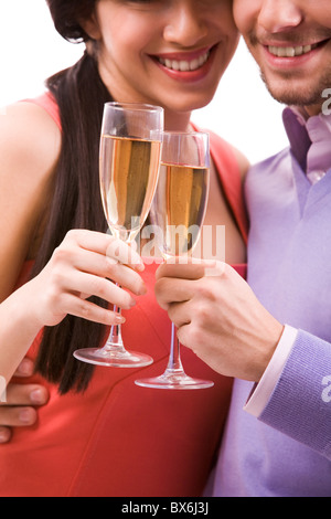 Portrait of happy couple with champagne flutes celebrating holiday Stock Photo