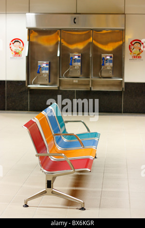 Seats and pay phones in the Kaohsiung Mass Rapid Transit station. Kaohsiung, Taiwan Stock Photo