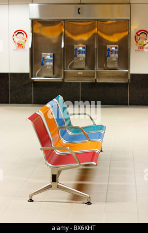 Seats and pay phones in the Kaohsiung Mass Rapid Transit station. Kaohsiung, Taiwan Stock Photo