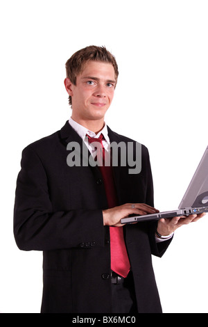 A motivated businessman working on his notebook computer. All isolated on white background. Stock Photo