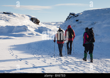 3 Walkers on the Kinder River in winter on Kinder Scout in the Dark ...